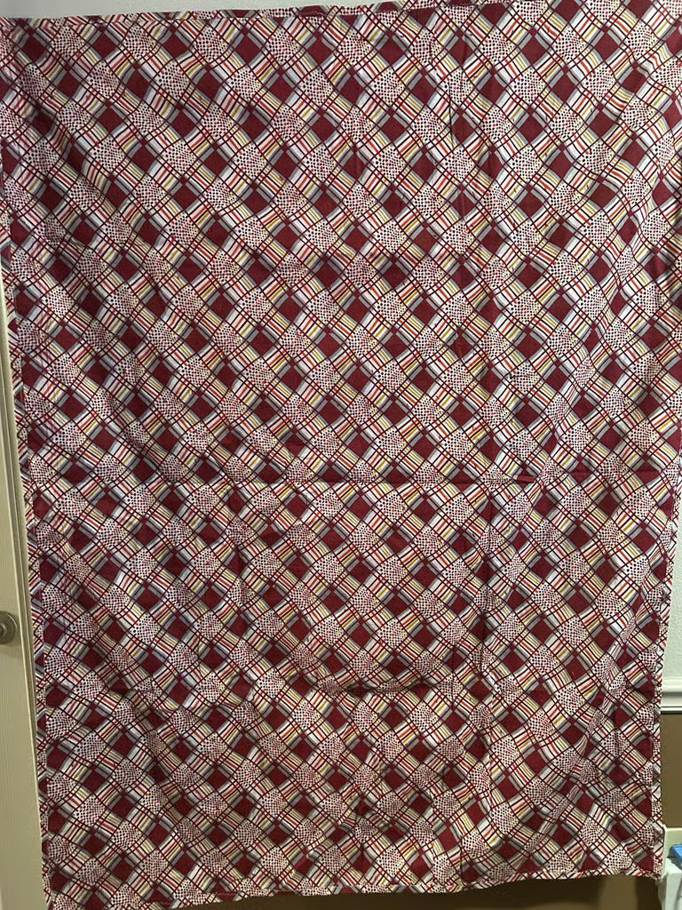 A vintage handmade quilt crafted on Fort Dodge Army Base by military wives 1970's